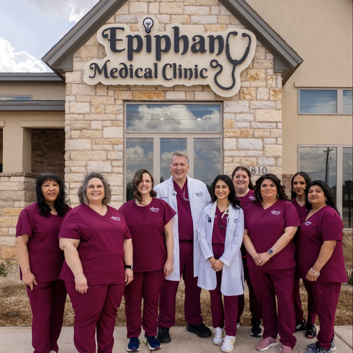 The Epiphany Medical Clinic team standing in front of their Lubbock clinic